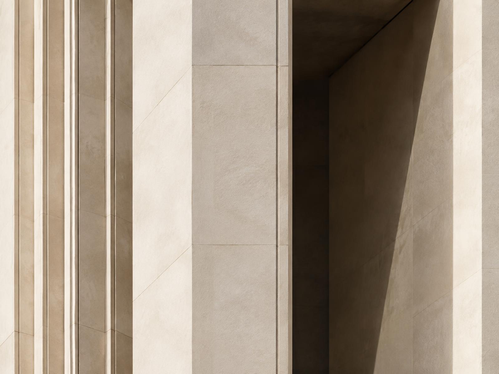 Architectural detail of a limestone facade in warm light